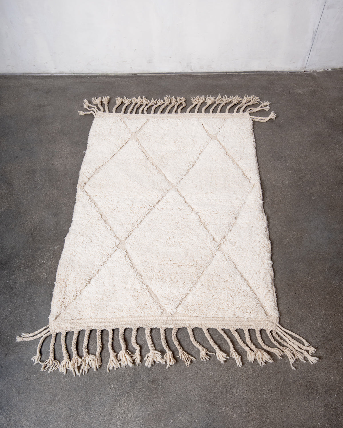 Modern, designer, handcrafted Berber rug from Morocco. Beniourain carpet with minimalist design, natural wool pile and a fluffy texture.